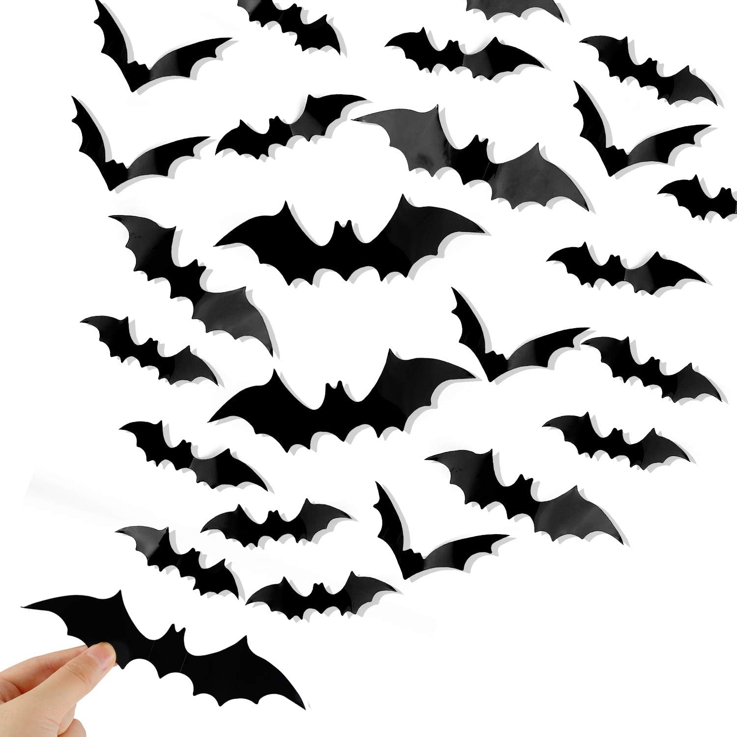 120-piece 3D black bat wall decals in four sizes arranged in a flying swarm pattern on a white background
