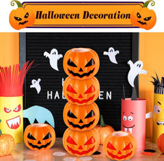 Orange pumpkin stress ball with a white ghost popping out