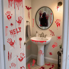 Bloody handprint decals on a glass door for Halloween decor