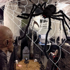 200-inch white triangular spider web stretched across a lawn with ground stakes