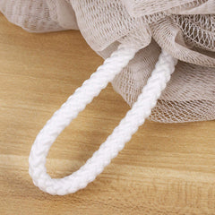 Bath loofahs in white, grey, green and light brown