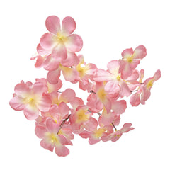 Pink cherry blossom stem arranged in a vase