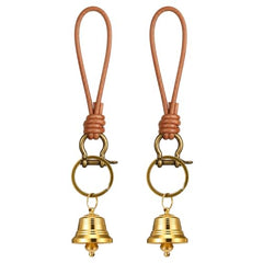 Small brass bell hanging on a door knob
