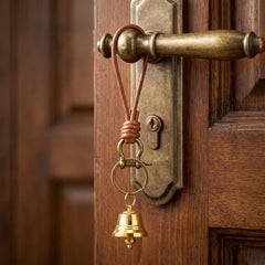 Close-up of brass door knob bell decoration