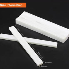 Flat white soapstone pencil marking a metal surface