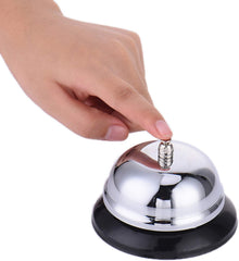 Desk call bell placed on a reception counter or front desk surface