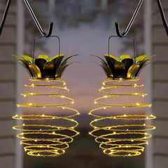 Solar pineapple hanging lantern lights glowing outdoors at night