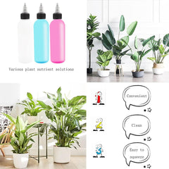 White, blue, and pink squeeze bottles filled with plant nutrient solutions shown alongside indoor houseplants