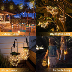 Close-up of pineapple lantern frame with LED string lights