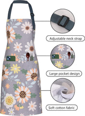 Two front pockets on floral cotton apron holding utensils and recipe cards