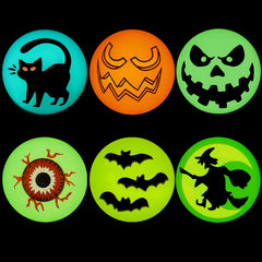 Close-up of Halloween bouncy balls showing pumpkin, ghost, and bat character prints