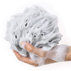 Mesh shower pouf lathering body wash in the shower