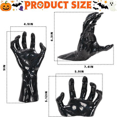Spooky reaching hand wall decor with flickering LED candle glowing in a dark room