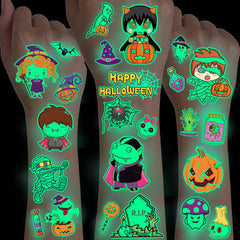 Glow-in-the-dark Halloween temporary tattoos with vampires, mummies, pumpkins, ghosts, and skeletons shown on arms