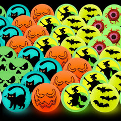 Halloween bouncy balls glowing in the dark after light exposure